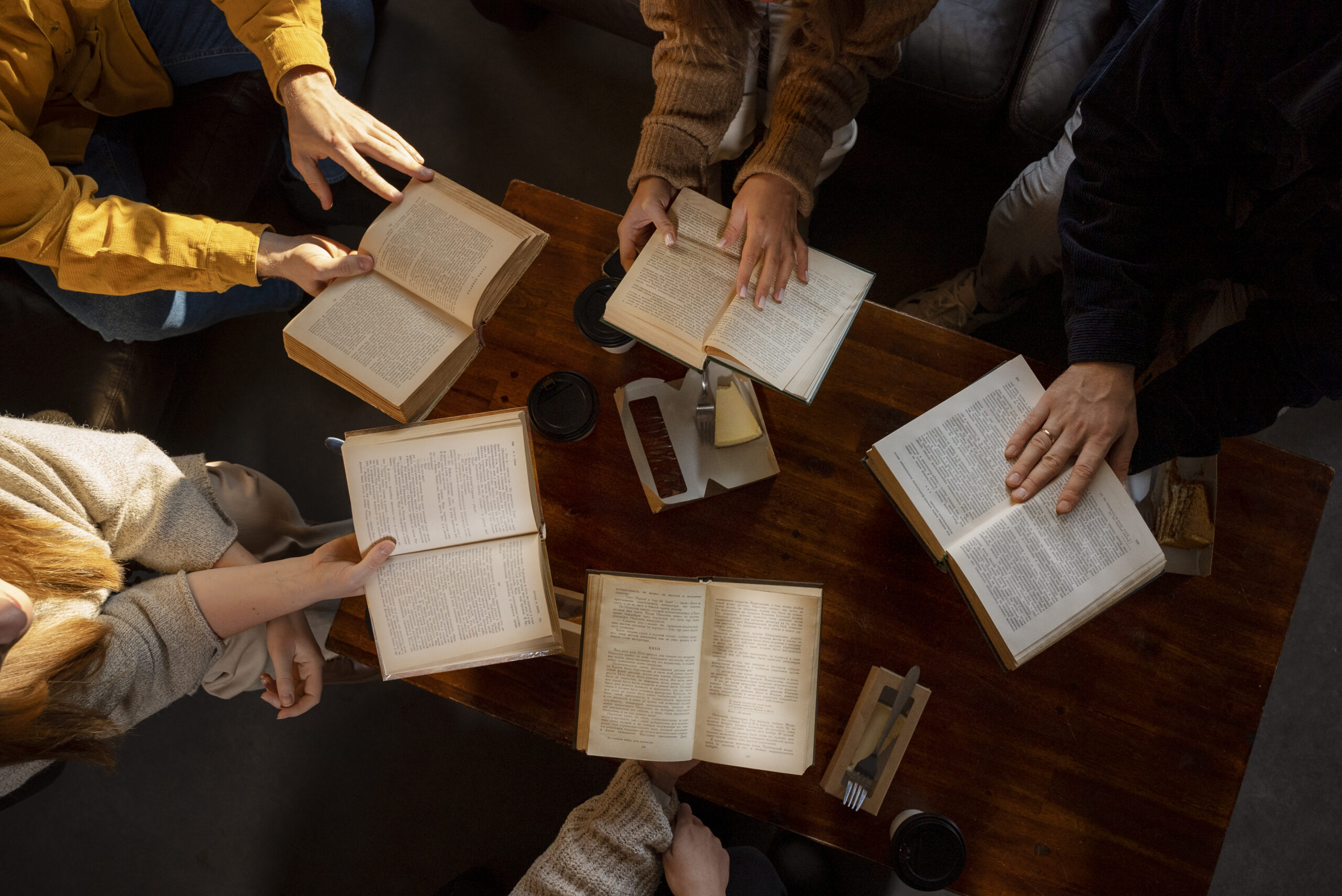 top-view-people-reading-together (1) Bible Study Groups